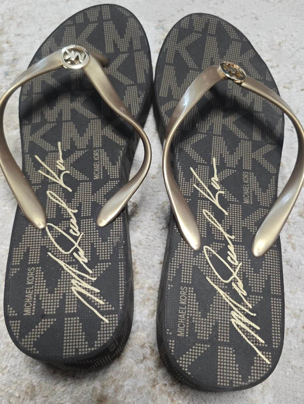 NWOT Michael Kors Black Footbed Flip Flops with Gold Straps